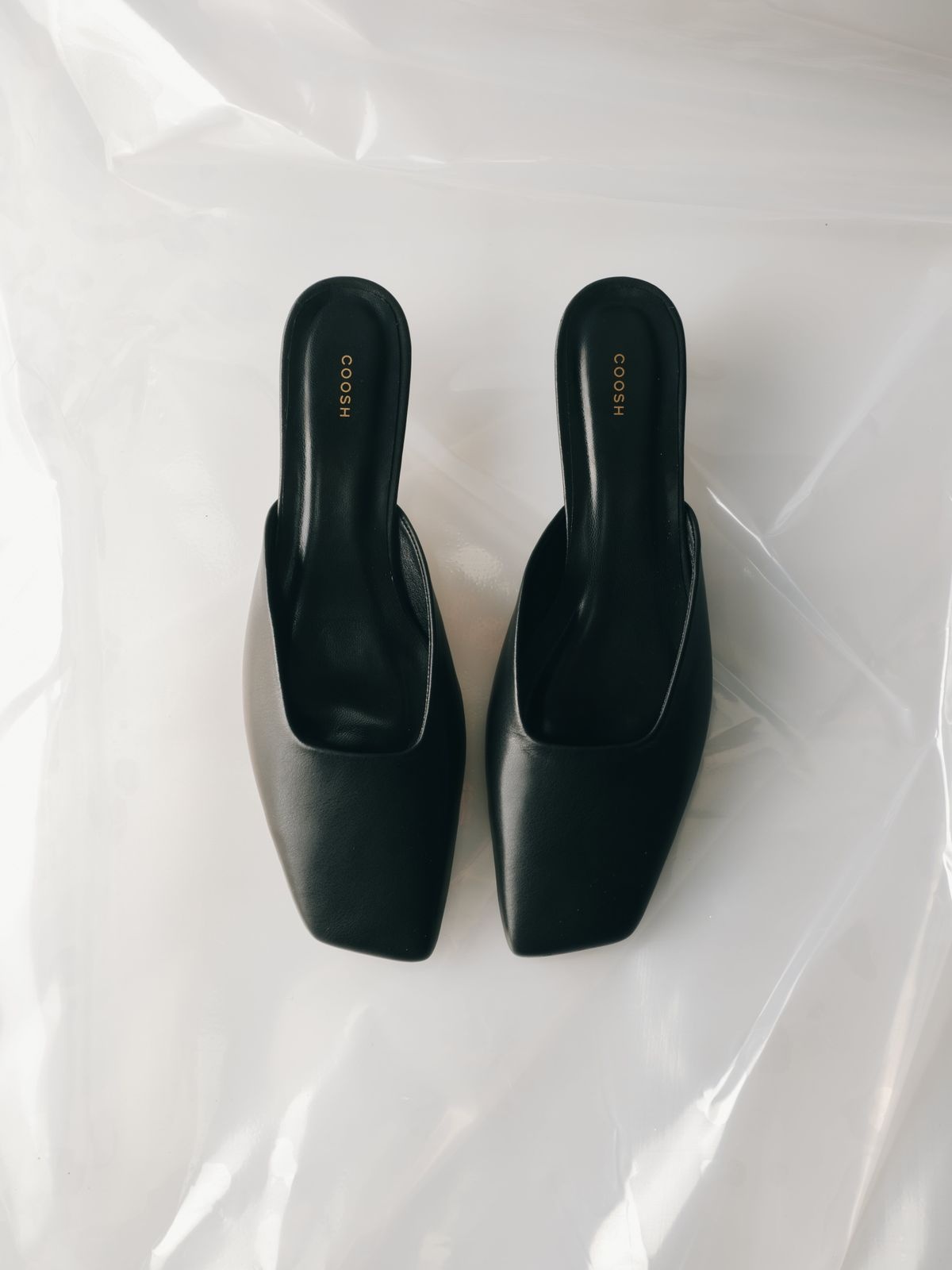 AMÉ Leather Mules with Asymmetric Toe